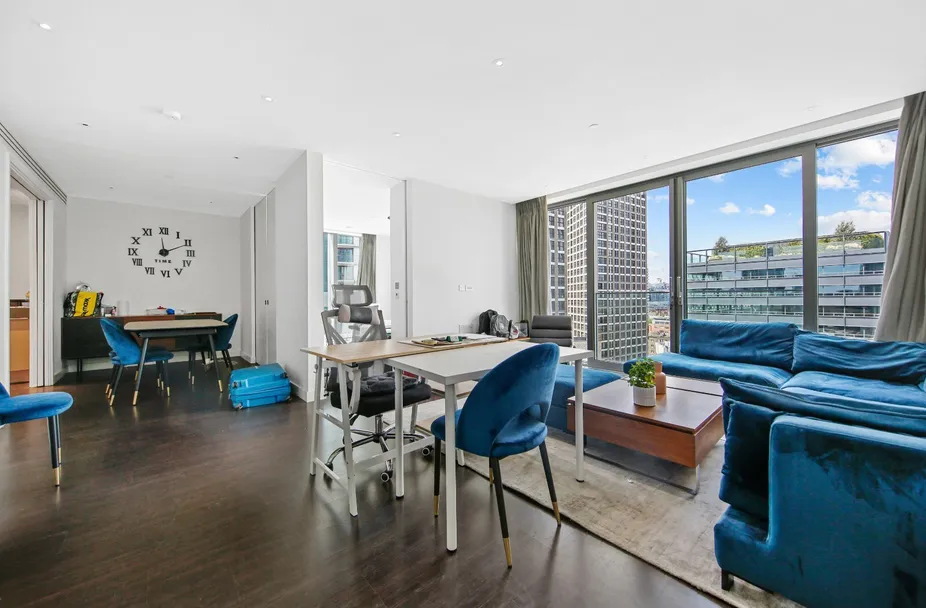 Open-plan living and dining room with floor-to-ceiling windows over the City