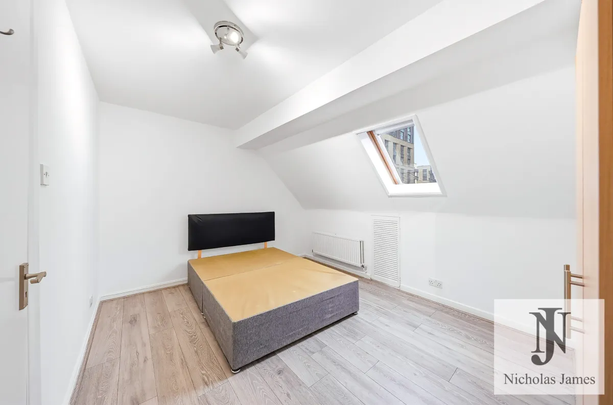 Bedroom with a skylight under the eaves